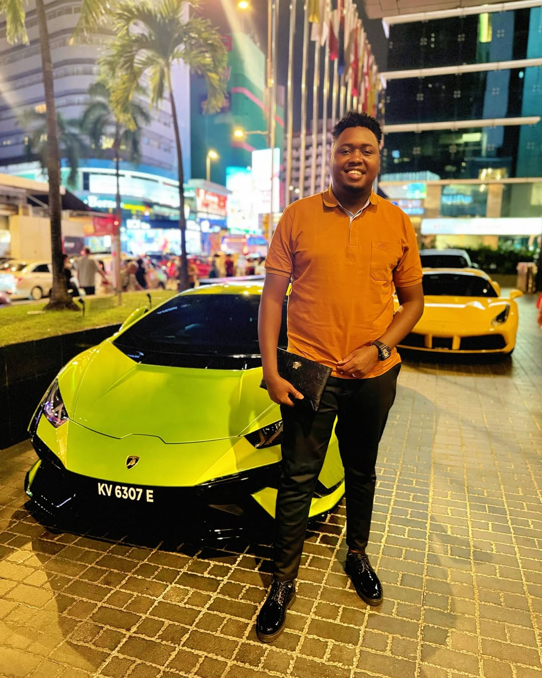 nebz standing next to a lamborghini