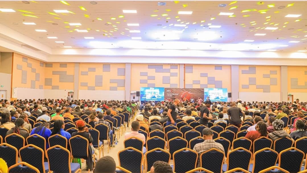 a conference room with a group of people